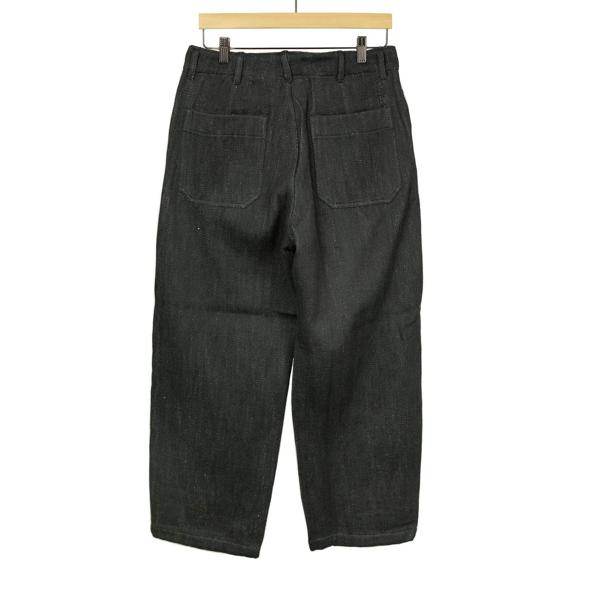 Flat front trousers in black slubby handwoven cotton denim
